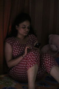 Young woman sitting in the mirror