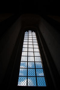 Low angle view of glass window in building