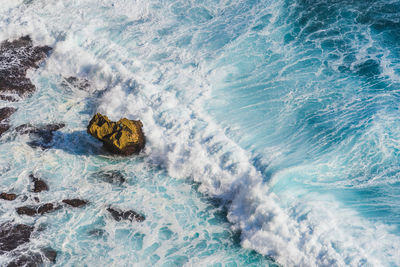 High angle view of waves in sea