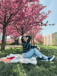 Low section of woman sitting in park