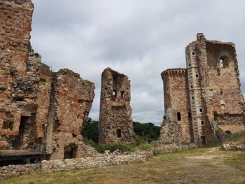 Old building against cloudy sky