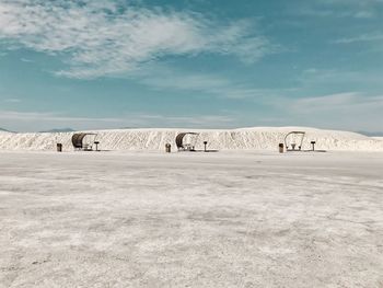 Scenic view of snowy field against sky