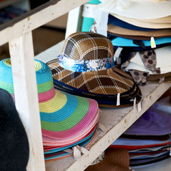 Close-up of multi colored umbrellas on table at market