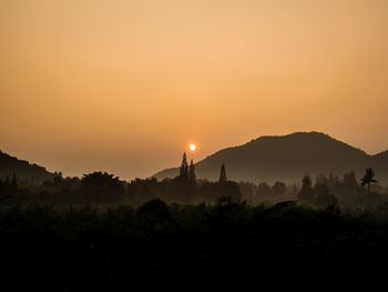 Scenic view of silhouette landscape against sky during sunset