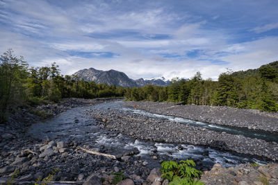 Scenic view of waterfall against sky