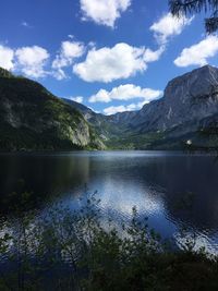 Scenic view of lake and mountains against sky