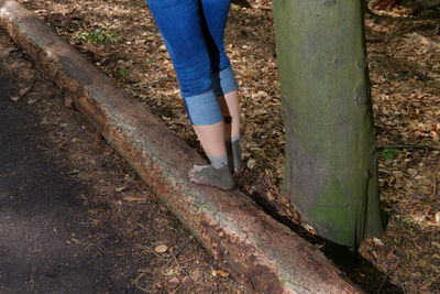 Low section of woman standing on ground