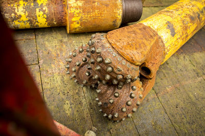 High angle view of old rusty metal on floor