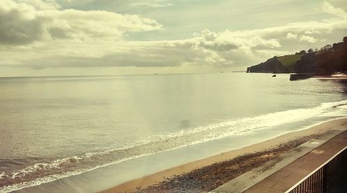 Scenic view of sea against cloudy sky