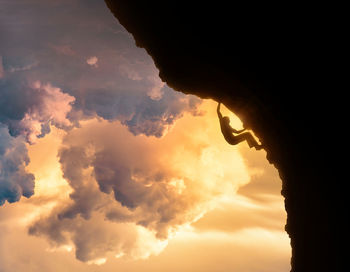 Low angle view of cloudy sky at sunset