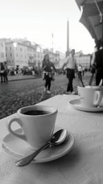 Close-up of coffee on table in city