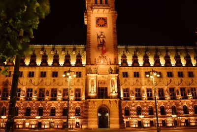 Low angle view of illuminated building at night