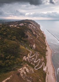 High angle view of sea shore against sky