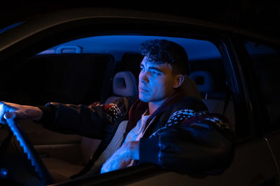 Man sitting in car