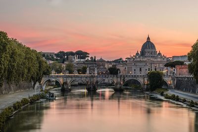 Arch bridge over river in city