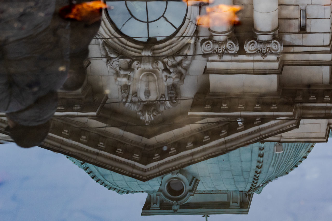 LOW ANGLE VIEW OF CLOCK ON BUILDING AGAINST SKY