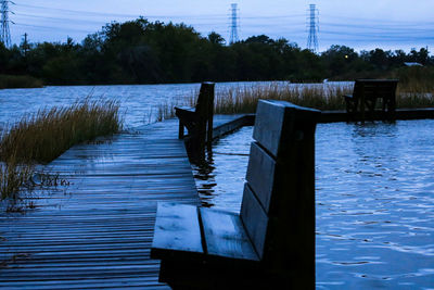 Pier over lake against sky