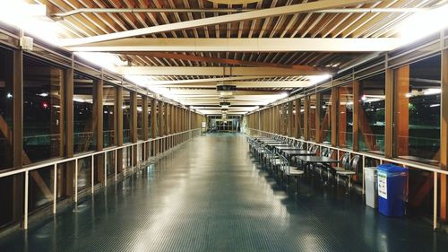 Train at illuminated underground walkway