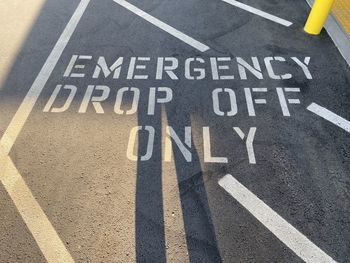 High angle view of arrow sign on road