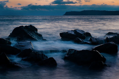 Scenic view of sea against sky during sunset