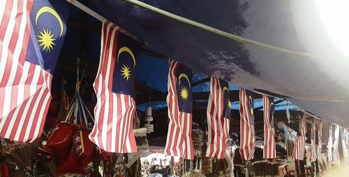 Low angle view of flags at beach