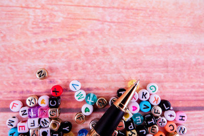 Directly above shot of pen and letters on table