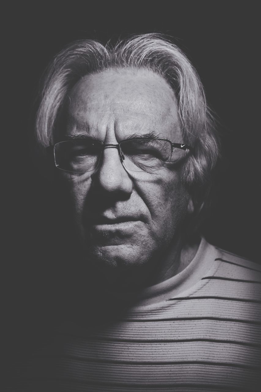 headshot, young adult, person, portrait, looking at camera, young men, indoors, close-up, front view, lifestyles, mid adult, beard, human face, mid adult men, serious, contemplation, leisure activity, studio shot