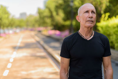 Portrait of man standing outdoors