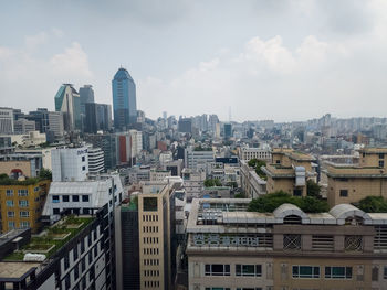 Buildings in city against sky