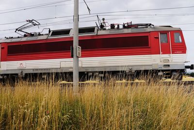 Train on railroad track against sky