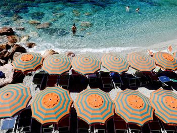 High angle view of multi colored beach umbrellas