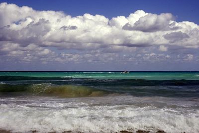 Scenic view of sea against cloudy sky