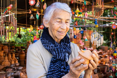 Portrait of a smiling young woman in market