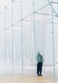 Man standing on floor against sky