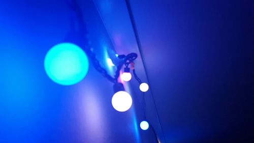 Low angle view of illuminated lighting equipment