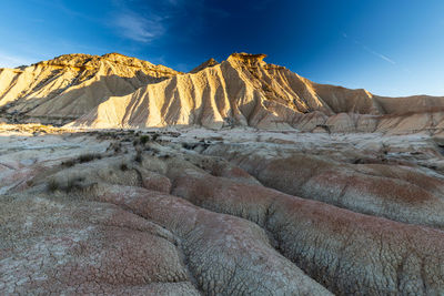 Scenic view of rock formations against sky