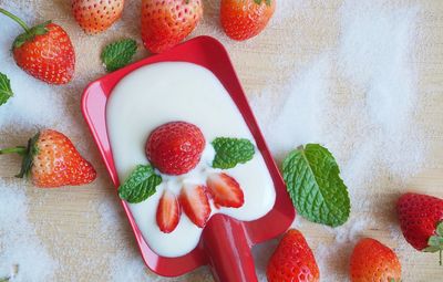 High angle view of strawberries on table