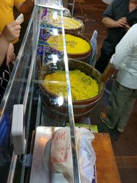 People for sale at market stall