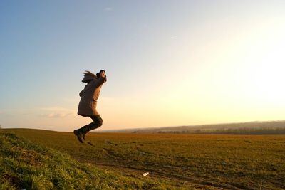 Full length of man on field against clear sky