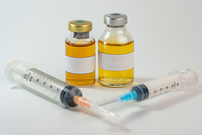 Close-up of bottles against white background