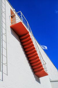 Low angle view of building against blue sky