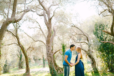 Young couple standing in forest