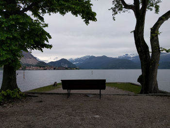 Empty bench on lakeshore