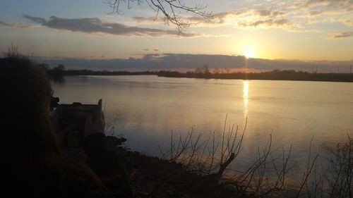 Scenic view of lake against sky during sunset