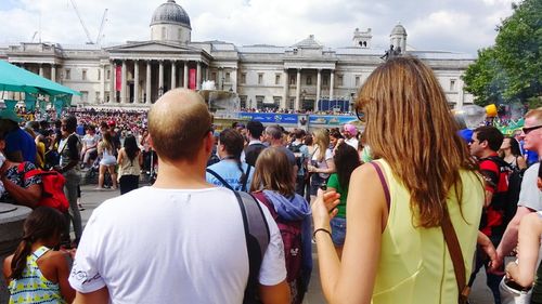 Group of people walking in front of building