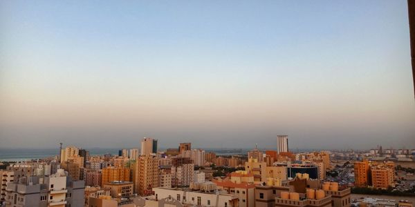 High angle view of buildings against sky during sunset