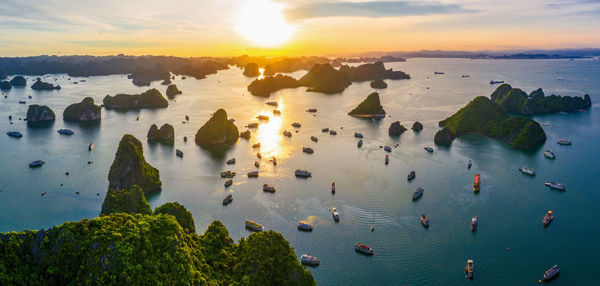 Aerial view of boats in sea during sunset