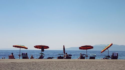 Scenic view of beach against clear sky