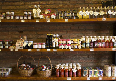 Graffiti of bottles on shelf at store