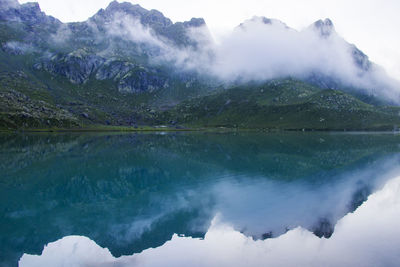 Mountain lake and fog, misty lake, amazing landscape okhrotskhali in the svaneti, georgia